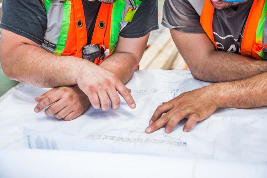 Engineers review HVAC and plumbing plans for construction defects